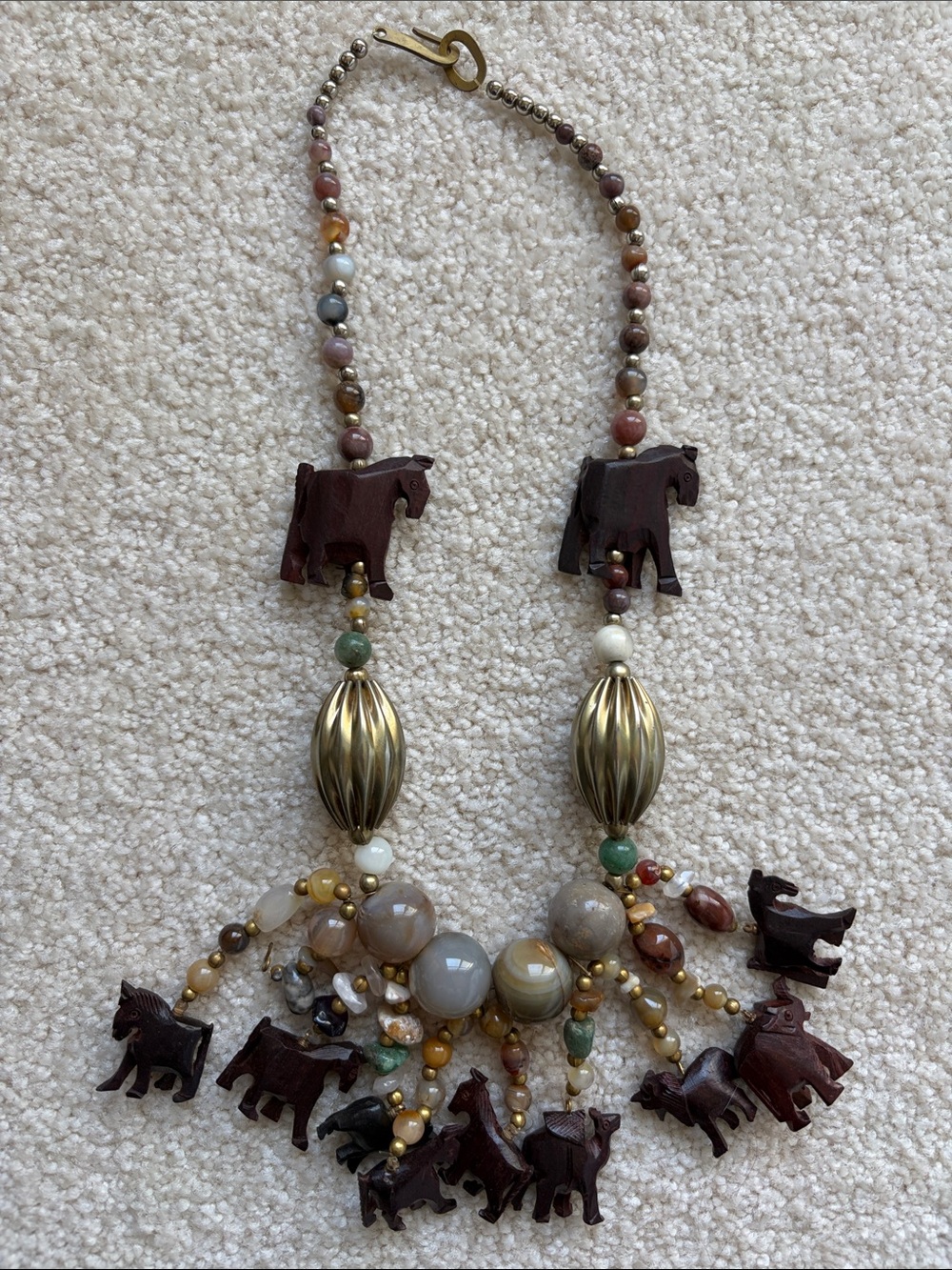 Vintage statement necklace with carved wooden animals and stone beads